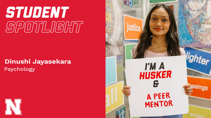 Student Spotlight Dinushi Jayasekara holding a sign that reads 